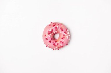 Stop motion video of donuts on a white background view from above. Delicious spinning pink, white and chocolate donuts