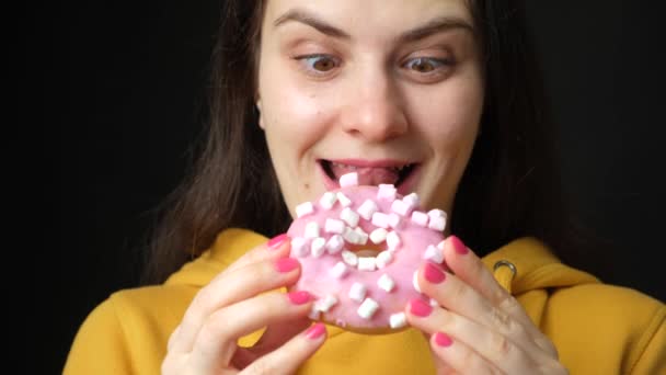 Woman Licks Looking Pink Marshmallow Donut Bites Black Background — Stock Video