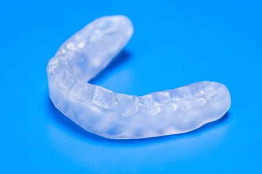 Dental mouthguard, splint for the treatment of dysfunction of the temporomandibular joints, bruxism, malocclusion, to relax the muscles of the jaw clipart