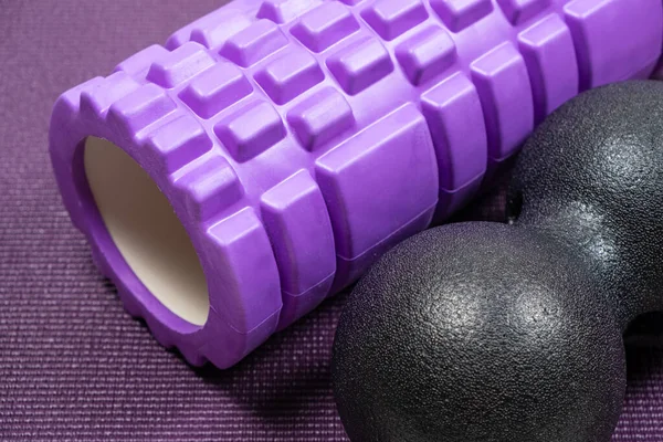 Massage roller and double ball to relax the muscles. Sports equipment.
