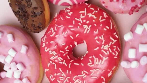 Donuts Red Pink Chocolate Icing Marshmallows Spin View — Stok Video