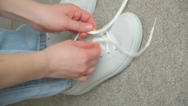 Woman Ties Her Shoelaces Her White Sneakers Walks Forward Her — Stock Video