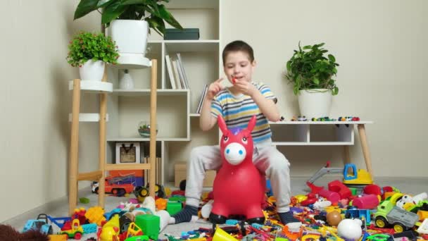 Little Year Old Boy Jumps Inflatable Donkey Toy Childrens Room — Stock Video