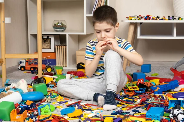 Little Boy Playing Toys Sitting Floor Scattered Toys Mess Childrens — Stock Photo, Image