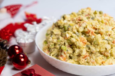 Olivier Russian salad on a Christmas and New Year background, top view