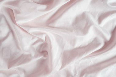 Abstract pink fabric background, satin stripe texture, wavy folds of elegant expensive fabric.