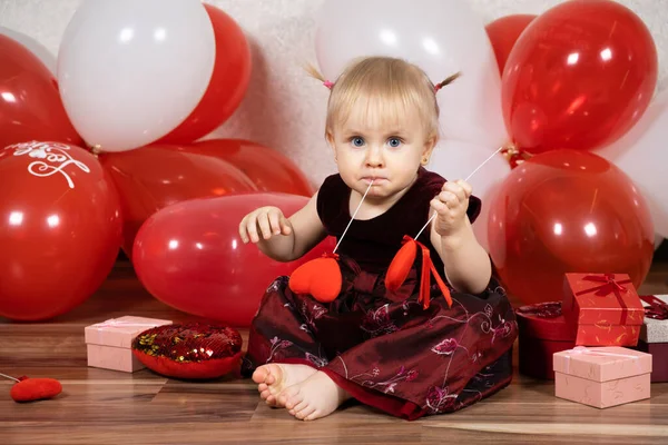 Cute Little Girl Blonde Plays Hearts Sticks Valentines Day —  Fotos de Stock