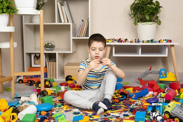 Little Boy Playing Toys Sitting Floor Scattered Toys Mess Childrens — Stock Photo, Image