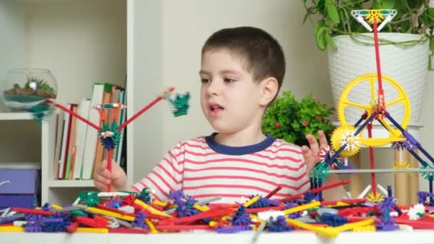 Little Boy Plays Constructor Creating Figures Gears Sticks Development Logic — Stock Video
