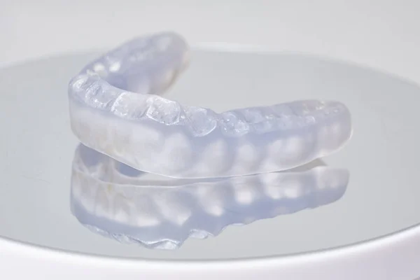 stock image Dental mouthguard, splint for the treatment of dysfunction of the temporomandibular joints, bruxism, malocclusion, to relax the muscles of the jaw