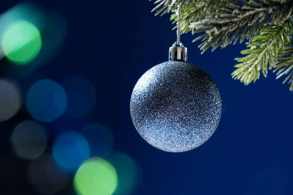 Blue Shiny Ball Snow Covered Branch Christmas Tree Blue Background — Stock Photo, Image