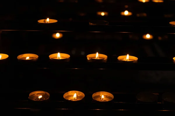 Stock image Burning candles in a Catholic Christian church.