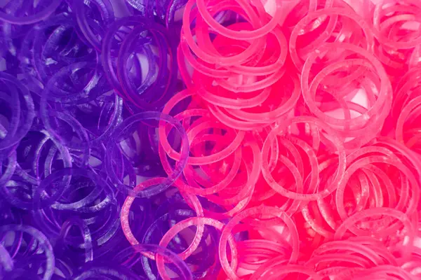 Pink and purple elastic bands for weaving bracelets for girls.