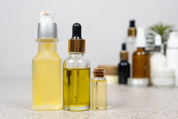 Natural oils for hair and skin care. Cosmetics in glass jars, eco-friendly products