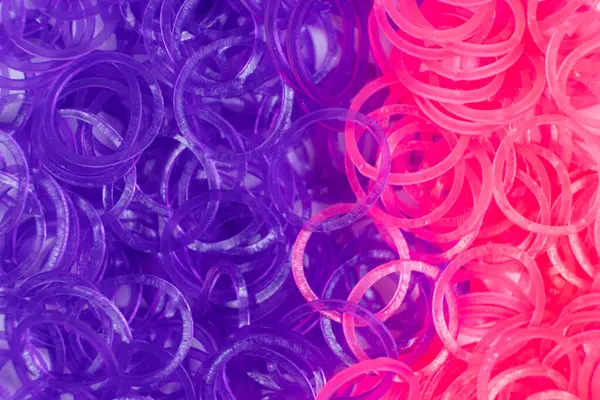 Pink and purple elastic bands for weaving bracelets for girls.