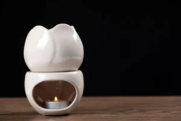 Oil burner aroma lamp, aromatic lamp with essential oils, copy space for text.