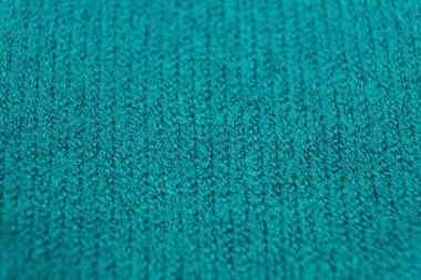 Viskoz, polyester ve naylondan yapılmış yeşil yumuşak kumaş. Kumaş endüstrisi, süveter kumaşı, seçici odak