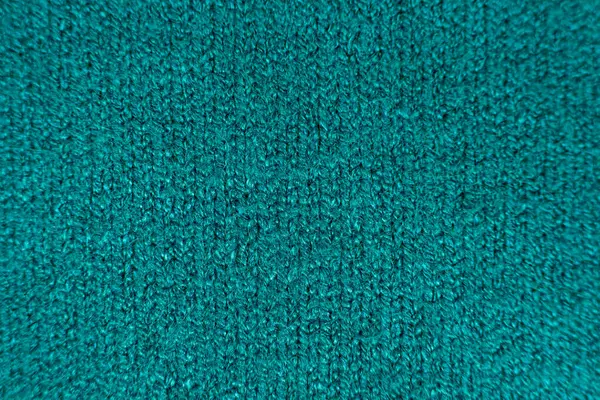 Green soft fabric made of viscose, polyester and nylon. Fabric industry, fabric for sweater.