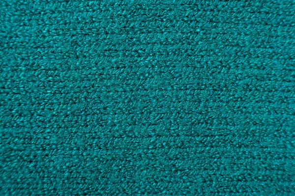 Green soft fabric made of viscose, polyester and nylon. Fabric industry, fabric for sweater.