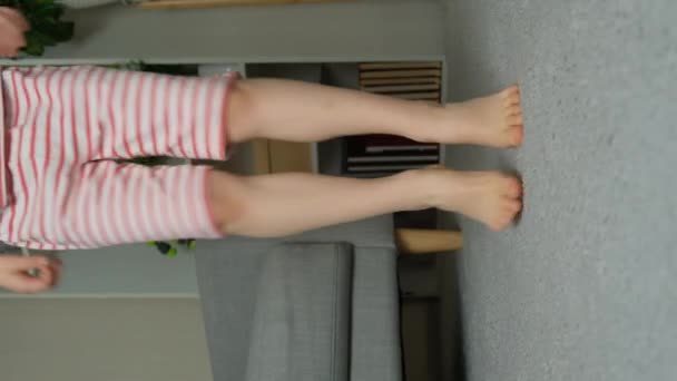 Happy Child Jumping Bos Carpet Legs Close Slow Motion — Stock video