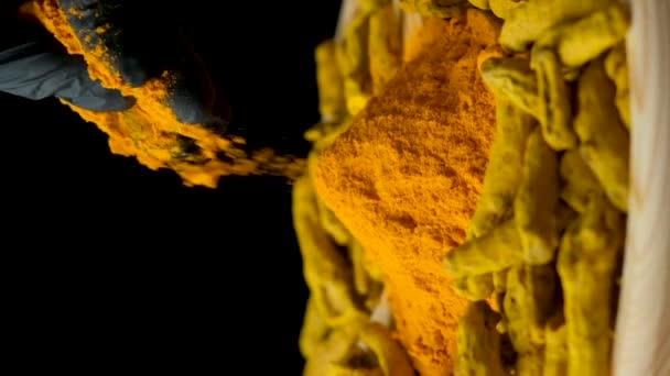 Man Sprinkling Turmeric Powder Vertical Slow Motion Black Background — Stock Video