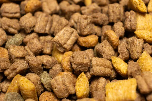 Dry food for puppies close-up. Complete diet for dogs during their first year of life.