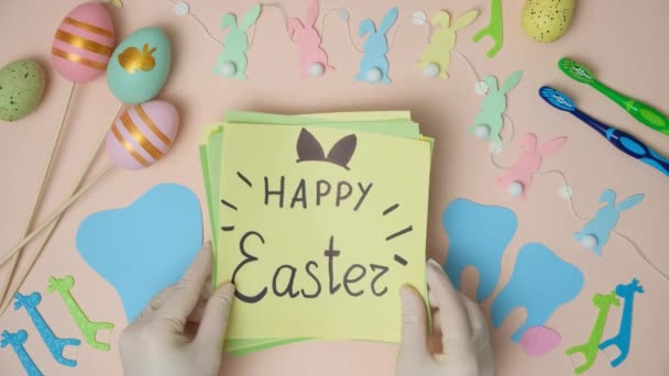 Dental Easter Gloves Hands Teeth Figurines Postcard Happy Easter Text — Stock Video