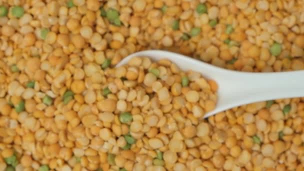 Pea Groats Pouring Spoon Plate Top View Slow Motion Macro — Stock Video