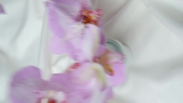 Laundry Detergent Poured Lid Falling Flowers Vertical Slow Motion — Stock Video