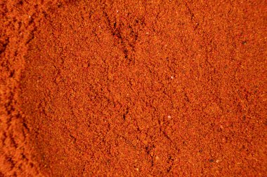 Tütsülenmiş paprikadan yapılan soyut kırmızı arkaplan. Baharat dokusu, yemekteki sanat