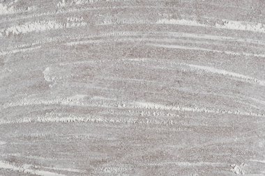 Arkaplanda dökülen buğday ununun gri pişirme arka planı, üst görünüm