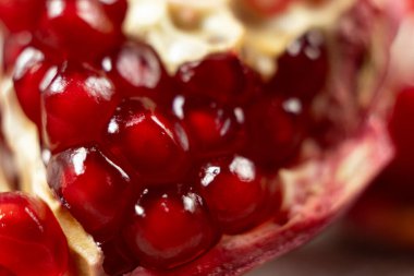 Pomegranate seeds in pomegranate, macro clipart