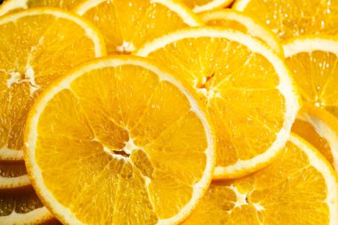 Dilimlenmiş portakaldan yapılmış sulu turuncu arkaplan.