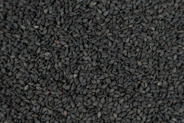 Tüm siyah susam tohumları üst görünüm detaylı çekim.