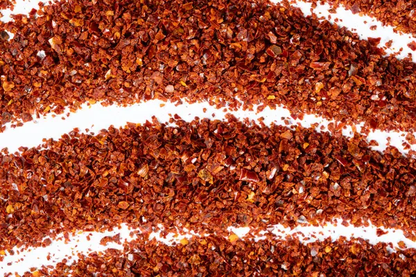 Koyu kırmızı biber tozu yakın çekim dokusu üst görünüm.