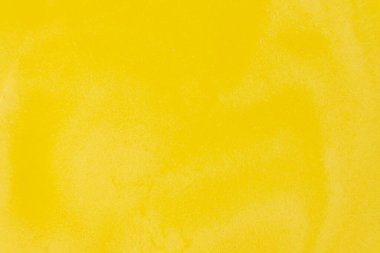 Erimiş sıvı ghee, berrak tereyağlı makro üst görünüm, sarı altın pişirme arka plan.