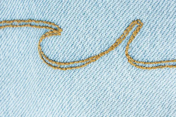 Mavi Kot Kumaş ve İplik Dikişlerinin Ayrıntılı Görünümü.