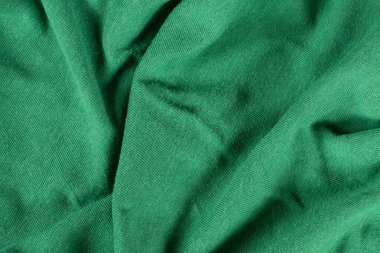 Pamuk ve viskoz içeren yeşil kumaşın makro dokusu