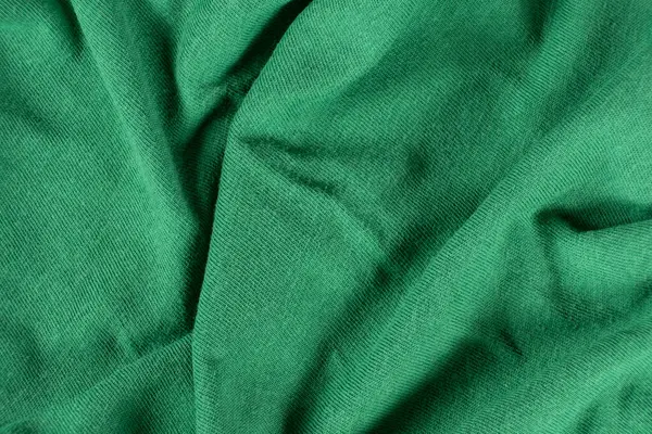 Pamuk ve viskoz içeren yeşil kumaşın makro dokusu