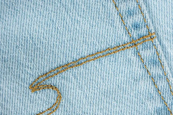 Mavi Kot Kumaş ve İplik Dikişlerinin Ayrıntılı Görünümü.