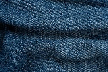 Pamuk mavisi kot kumaşın makro dokusu.