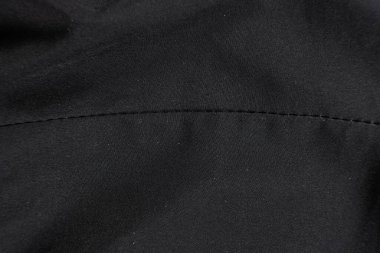 Eski yıpranmış polyester ve elastik kumaş, iplikler.