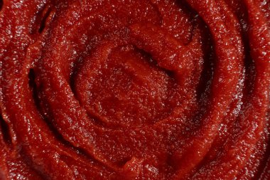 Organik Domates Yapıştırıcısı Yakın plan. Yemek pişirmek için Pürüzsüz Kırmızı Dağıtım