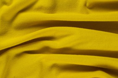 Zengin sarı kumaş arkaplan, desen ve makro doku.