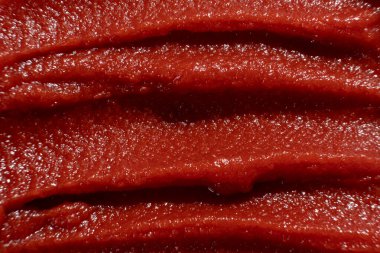 Zengin domates ezmesinin makro dokusu. Mutfak Kırmızı Arkaplanı