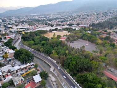Expansive aerial shot showing the cityscape of Chilpancingo with the winding Huacapa River, captured horizontally clipart