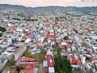 Horizontal aerial shot displaying the residential landscapes and colorful districts within Chilpancingo clipart