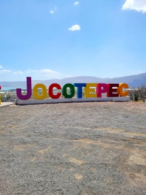 Brightly colored Jocotepec sign at the famous lookout point, offering panoramic views of Jalisco's landscapes clipart
