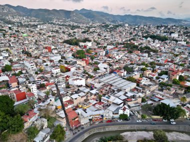Drone-captured horizontal aerial view showcasing the vibrant and varied neighborhoods of Chilpancingo clipart