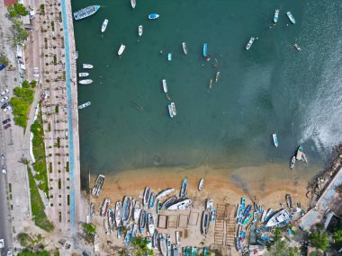 Overhead view revealing the hurricane's impact on both the Fisherman's Walk and Manzanillo Beach clipart